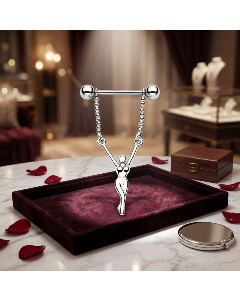 Piercing téton femme en acier chirurgical avec bijou suspendu silhouette féminine sur plateau velours bordeaux
